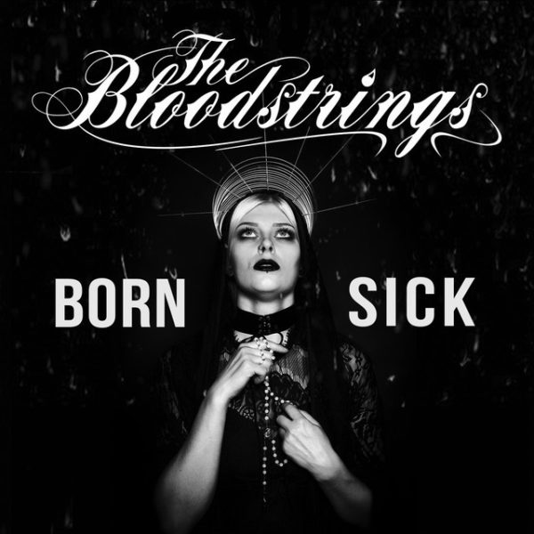 Cover der LP Born Sick Sängerin gekleidet wie eine Maria in Schwarz